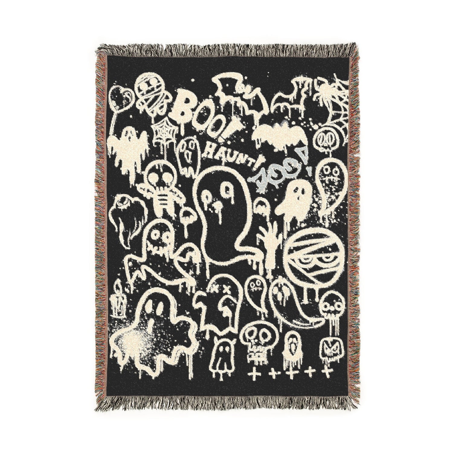 Decorative throw blanket with Halloween-themed design on a black background