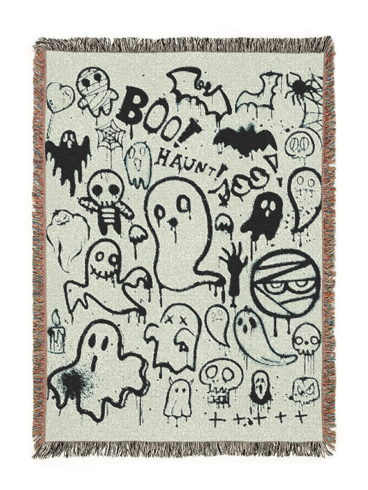 Halloween-themed blanket with black graphics on a white background