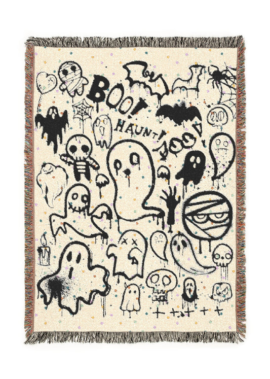 Decorative Halloween-themed blanket with black graphics on a beige background