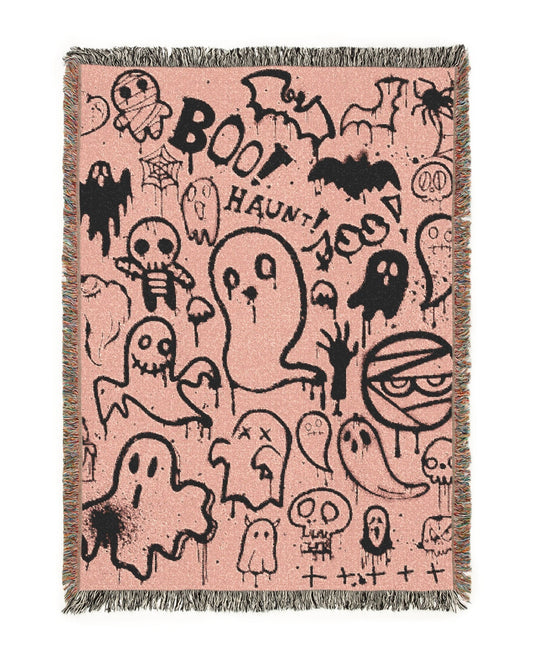 Pink blanket with Halloween-themed ghost and ghostbusters logo design on a white background